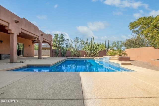 view of swimming pool featuring a patio and ceiling fan