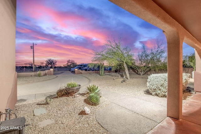 view of patio terrace at dusk