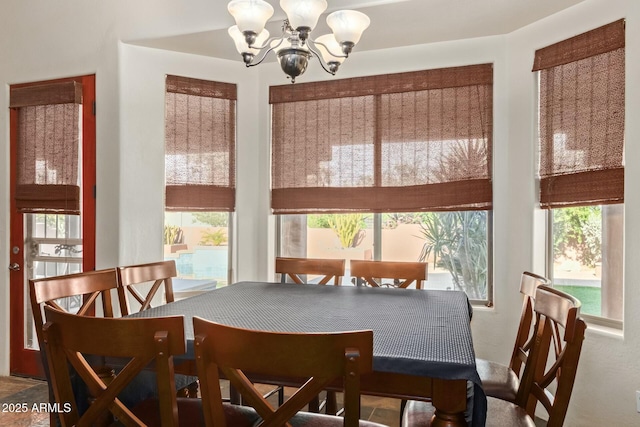 dining space with a chandelier