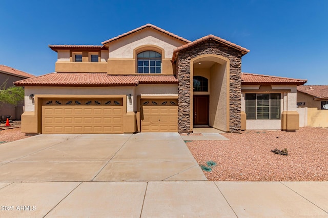 7418 S 25th Ln, Phoenix, AZ 85041 - mediterranean / spanish house featuring stucco siding, a tiled roof, and concrete driveway