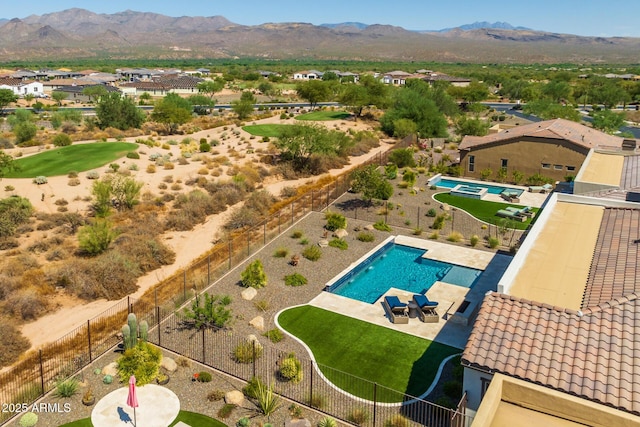 birds eye view of property featuring a mountain view