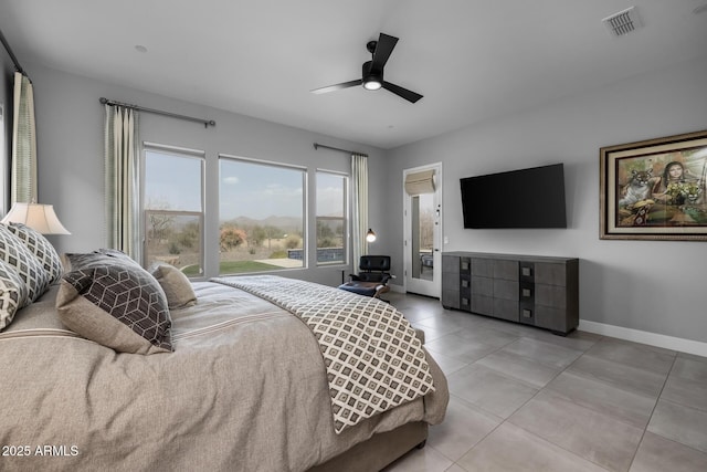 bedroom with light tile patterned floors, ceiling fan, visible vents, and baseboards