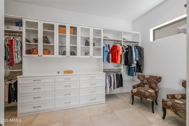 spacious closet with light tile patterned flooring