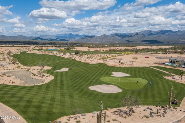 bird's eye view featuring view of golf course and a mountain view