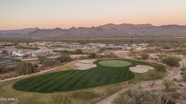 view of property's community featuring a residential view, view of golf course, and a mountain view