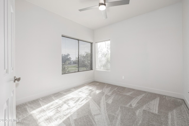 unfurnished room with carpet, baseboards, and ceiling fan