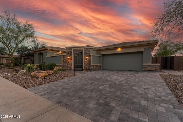 3045 W Feather Sound Dr, Phoenix, AZ 85086 - prairie-style home with stone siding, stucco siding, decorative driveway, and an attached garage