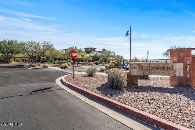 3045 W Feather Sound Dr, Phoenix, AZ 85086 - view of asphalt road featuring traffic signs, curbs, and street lights