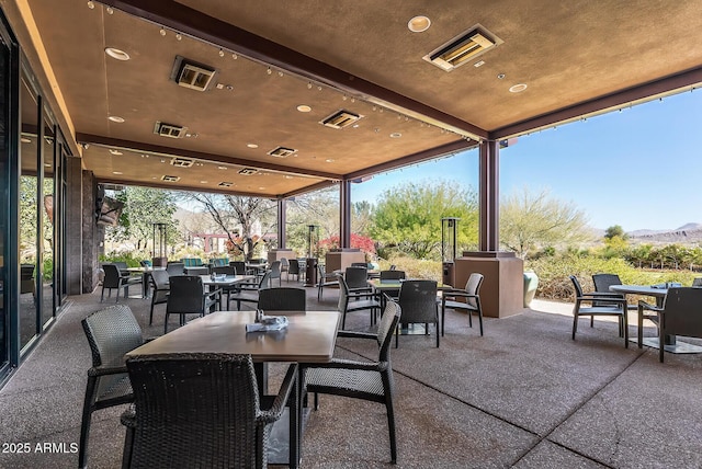 3045 W Feather Sound Dr, Phoenix, AZ 85086 - view of patio with outdoor dining space and a mountain view