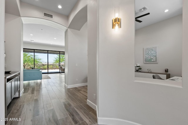 3045 W Feather Sound Dr, Phoenix, AZ 85086 - hall with baseboards, wood finished floors, recessed lighting, and arched walkways
