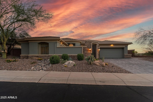 3045 W Feather Sound Dr, Phoenix, AZ 85086 - prairie-style house featuring stone siding, stucco siding, a garage, decorative driveway, and a tiled roof
