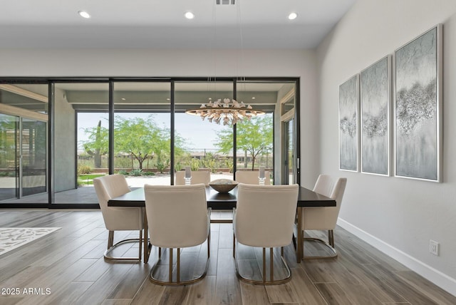 3045 W Feather Sound Dr, Phoenix, AZ 85086 - dining space featuring a chandelier, plenty of natural light, wood finished floors, recessed lighting, and baseboards