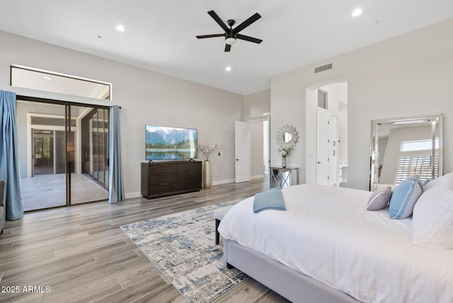 3045 W Feather Sound Dr, Phoenix, AZ 85086 - bedroom with access to exterior, arched walkways, recessed lighting, wood finished floors, and baseboards