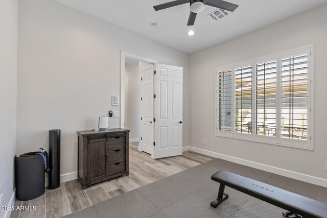 3045 W Feather Sound Dr, Phoenix, AZ 85086 - workout room with wood finished floors, a ceiling fan, baseboards, and recessed lighting