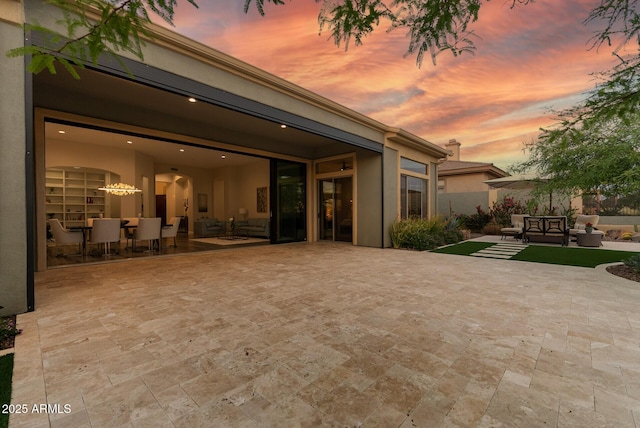 3045 W Feather Sound Dr, Phoenix, AZ 85086 - back of property at dusk featuring a patio area and stucco siding
