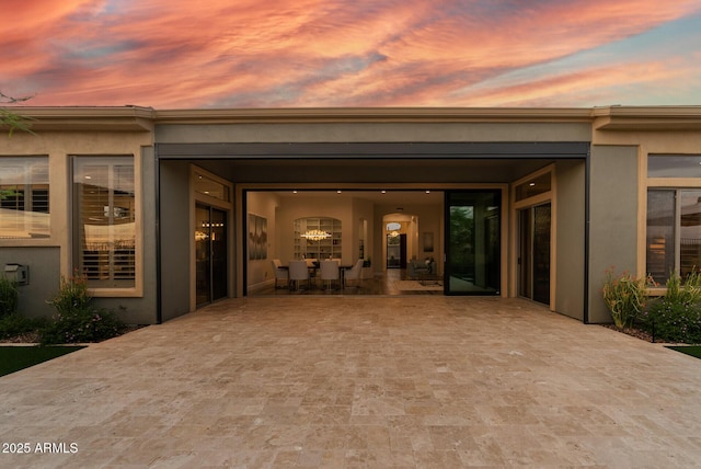 3045 W Feather Sound Dr, Phoenix, AZ 85086 - back of house at dusk with stucco siding and a patio area