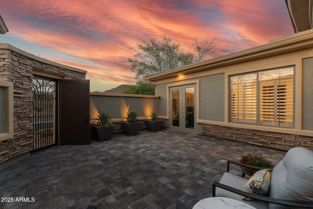 3045 W Feather Sound Dr, Phoenix, AZ 85086 - patio terrace at dusk with french doors and a patio area