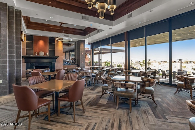3045 W Feather Sound Dr, Phoenix, AZ 85086 - dining space featuring expansive windows, a raised ceiling, a towering ceiling, and a chandelier