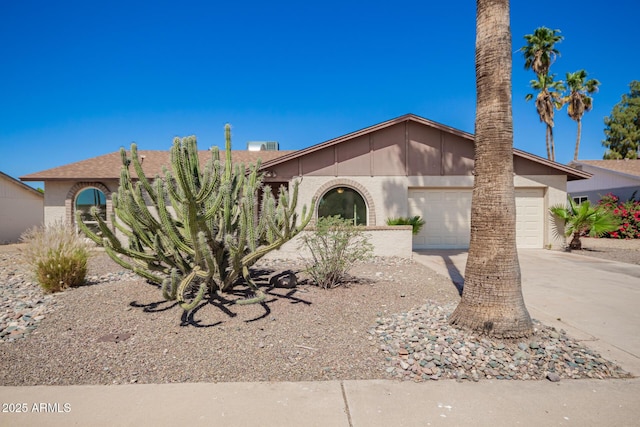 17244 N 36th Ln, Glendale, AZ 85308 - view of front facade featuring driveway, an attached garage, and stucco siding