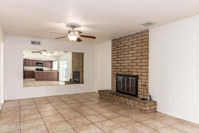 17244 N 36th Ln, Glendale, AZ 85308 - unfurnished living room featuring a fireplace and ceiling fan