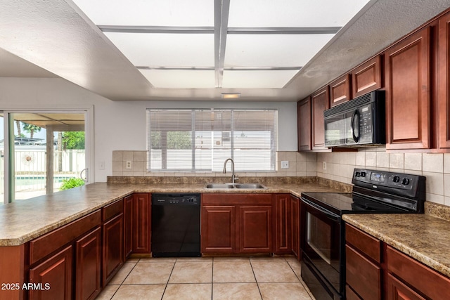 17244 N 36th Ln, Glendale, AZ 85308 - kitchen with black appliances, a sink, light tile patterned floors, tasteful backsplash, and a peninsula