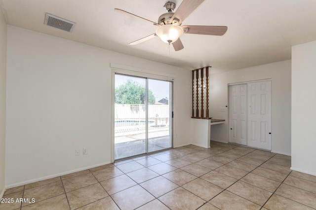 17244 N 36th Ln, Glendale, AZ 85308 - empty room with a ceiling fan and light tile patterned floors