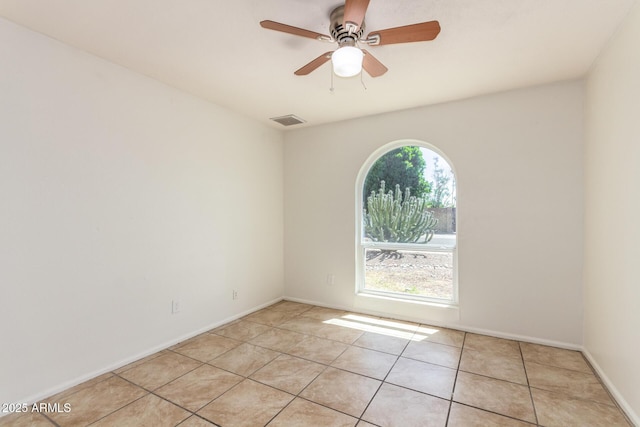 17244 N 36th Ln, Glendale, AZ 85308 - empty room featuring light tile patterned floors, a ceiling fan, and baseboards