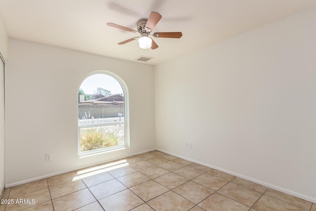 17244 N 36th Ln, Glendale, AZ 85308 - unfurnished room featuring light tile patterned flooring, a ceiling fan, and baseboards