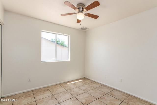17244 N 36th Ln, Glendale, AZ 85308 - spare room with baseboards, light tile patterned flooring, and a ceiling fan