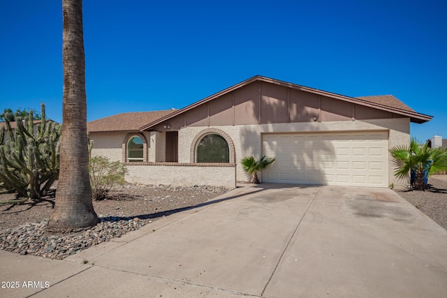 17244 N 36th Ln, Glendale, AZ 85308 - view of front of property featuring driveway, an attached garage, and stucco siding