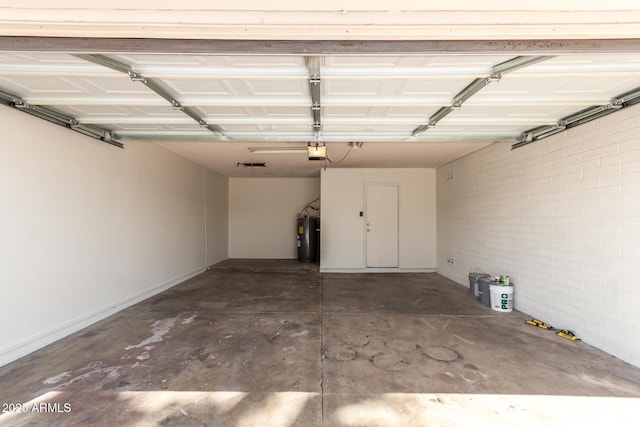 17244 N 36th Ln, Glendale, AZ 85308 - garage with electric water heater, a garage door opener, and baseboards