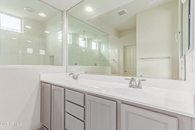 16221 W Prickly Pear Trl, Surprise, AZ 85387 - full bathroom featuring double vanity and a tile shower