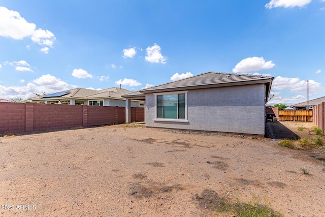 16221 W Prickly Pear Trl, Surprise, AZ 85387 - rear view of property featuring a fenced backyard, stucco siding, and a tile roof