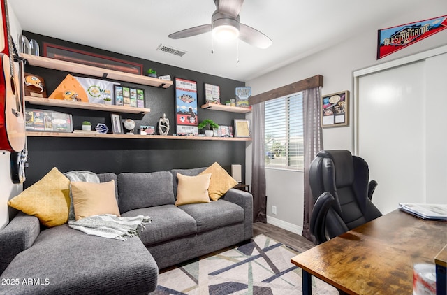 home office featuring ceiling fan and light hardwood / wood-style floors