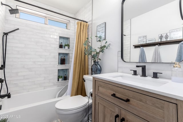 full bathroom featuring vanity, shower / bath combination with curtain, and toilet