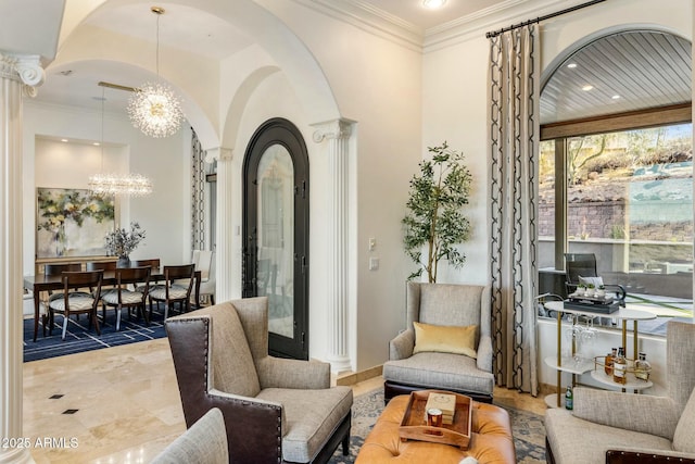 11320 N Crestview Dr, Fountain Hills, AZ 85268 - interior space with arched walkways, ornate columns, an inviting chandelier, and crown molding