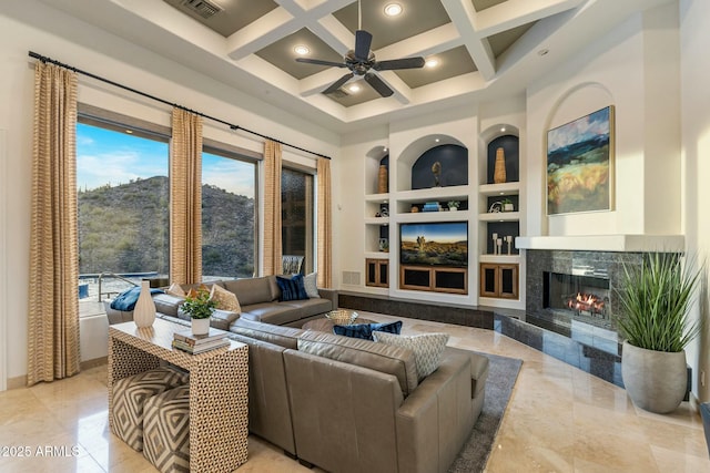11320 N Crestview Dr, Fountain Hills, AZ 85268 - living area featuring coffered ceiling, a high ceiling, ceiling fan, a high end fireplace, and built in features
