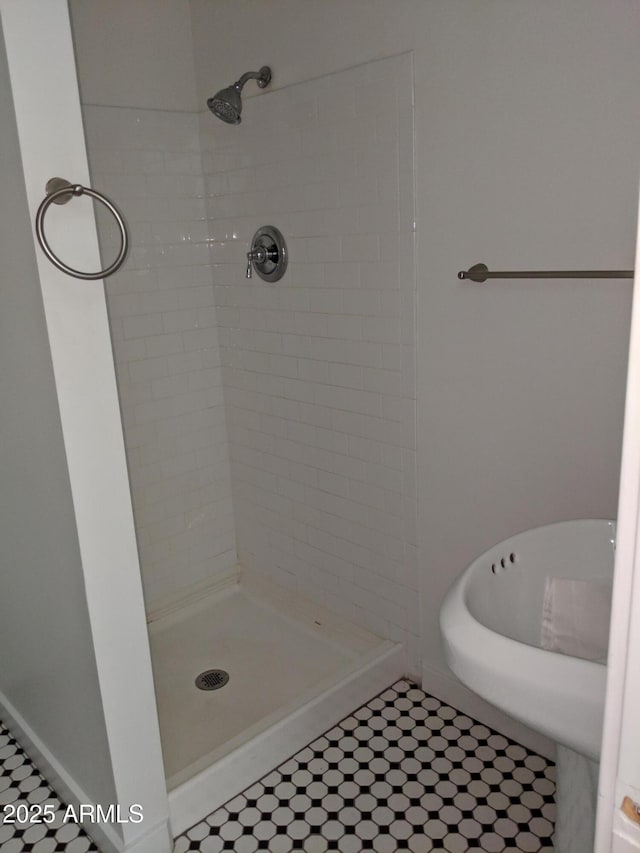 full bath with a shower stall and tile patterned floors