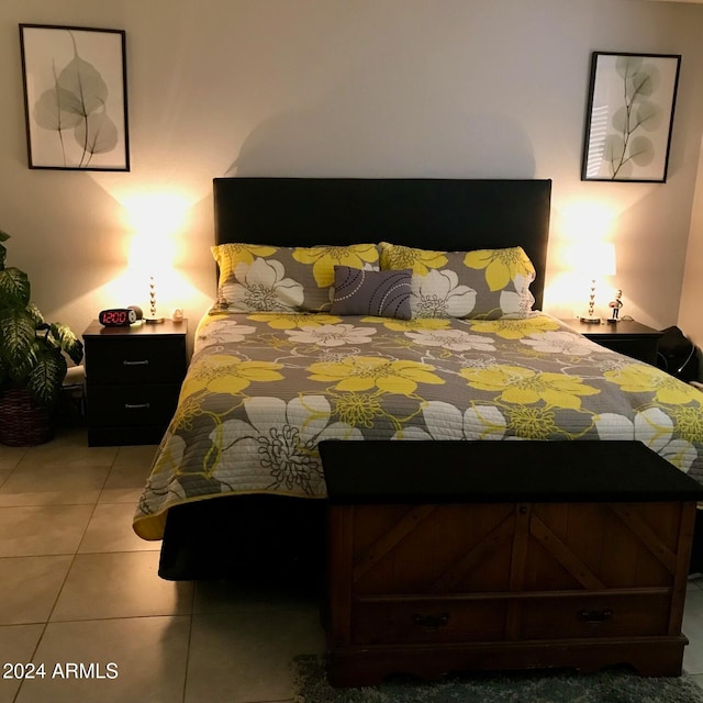 bedroom featuring light tile patterned flooring