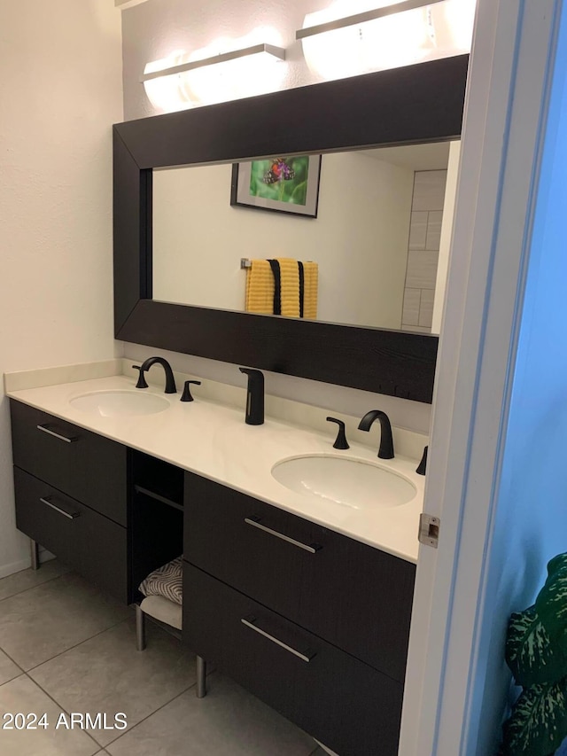 bathroom featuring tile patterned flooring and vanity