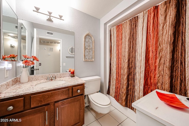 full bath with vanity, toilet, and tile patterned floors