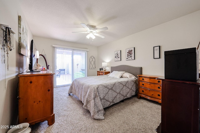 bedroom with light carpet, access to outside, ceiling fan, and a textured ceiling