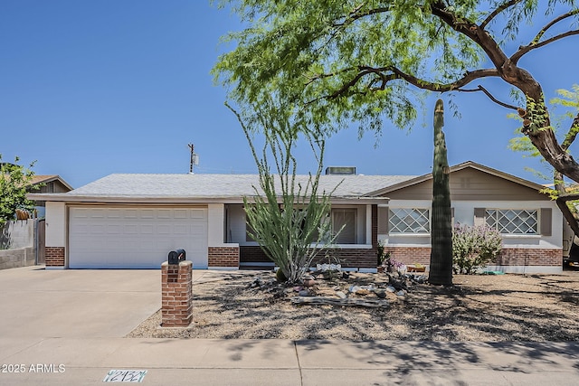 2432 W Echo Ln, Phoenix, AZ 85021 - single story home featuring brick siding, driveway, an attached garage, and a shingled roof