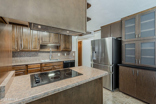 2432 W Echo Ln, Phoenix, AZ 85021 - kitchen with black appliances, light countertops, backsplash, and glass insert cabinets