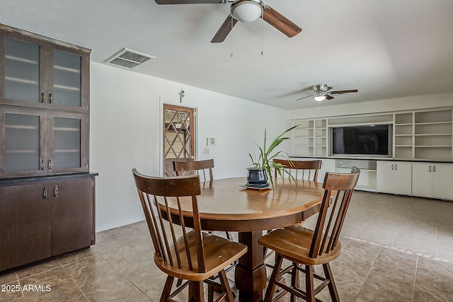 2432 W Echo Ln, Phoenix, AZ 85021 - tiled dining space with ceiling fan