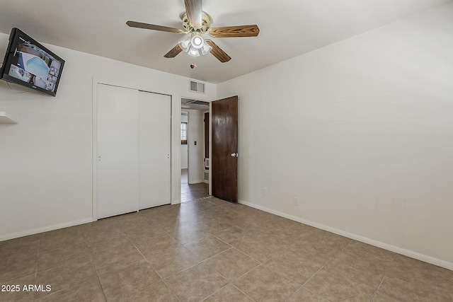 2432 W Echo Ln, Phoenix, AZ 85021 - unfurnished bedroom featuring tile patterned flooring, a ceiling fan, and a closet