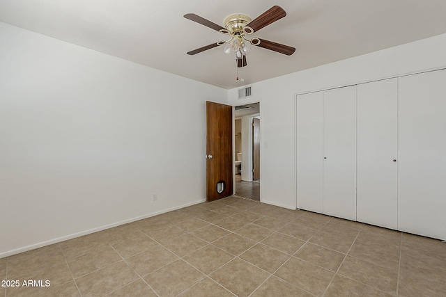 2432 W Echo Ln, Phoenix, AZ 85021 - unfurnished bedroom featuring a closet, ceiling fan, and light tile patterned floors