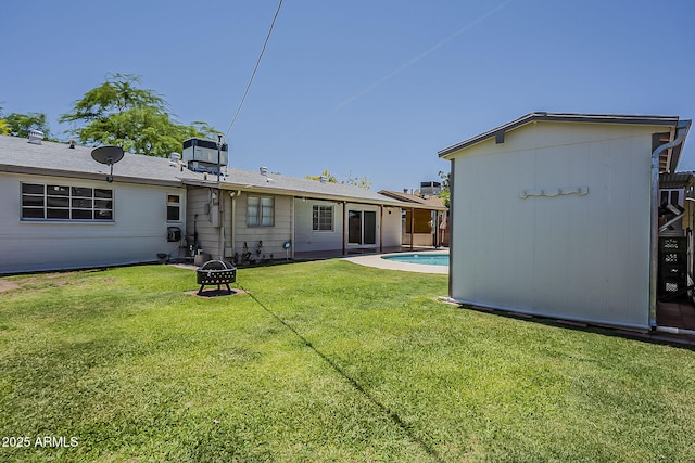 2432 W Echo Ln, Phoenix, AZ 85021 - rear view of house with a fire pit and a lawn