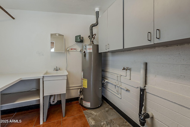 2432 W Echo Ln, Phoenix, AZ 85021 - utility room with gas water heater and a sink