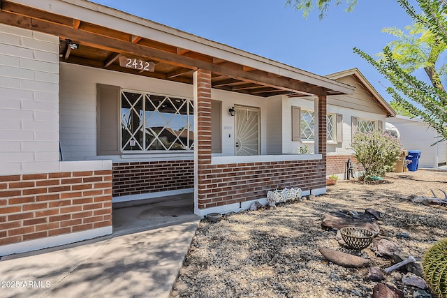 2432 W Echo Ln, Phoenix, AZ 85021 - view of exterior entry with brick siding and covered porch